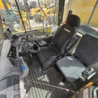 Komatsu HM400-3R articulated dump truck cabin interior with operator seat and controls