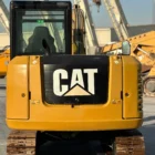 Rear view of Caterpillar 305.5E2 mini excavator, showing counterweight, CAT logo and steel tracks